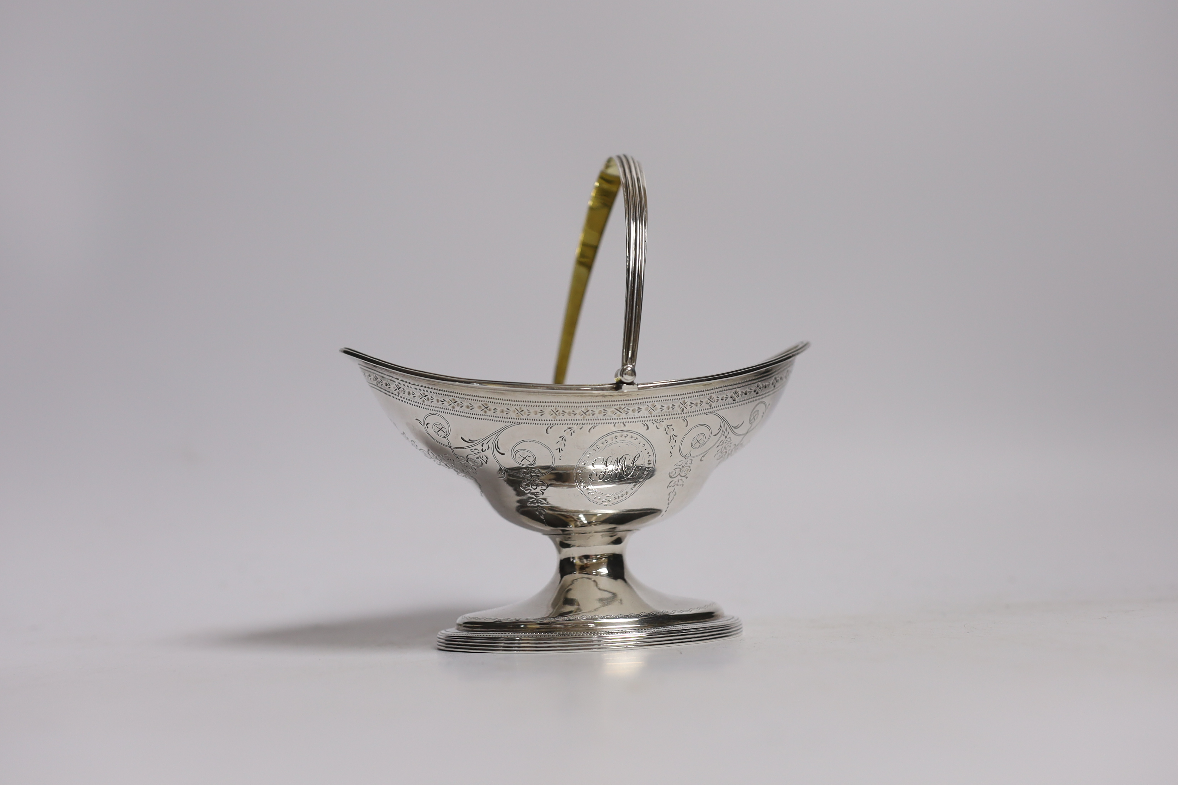 A George III engraved silver sugar basket, by Hester Bateman, London, 1790, width 13.7cm, 4.4oz.